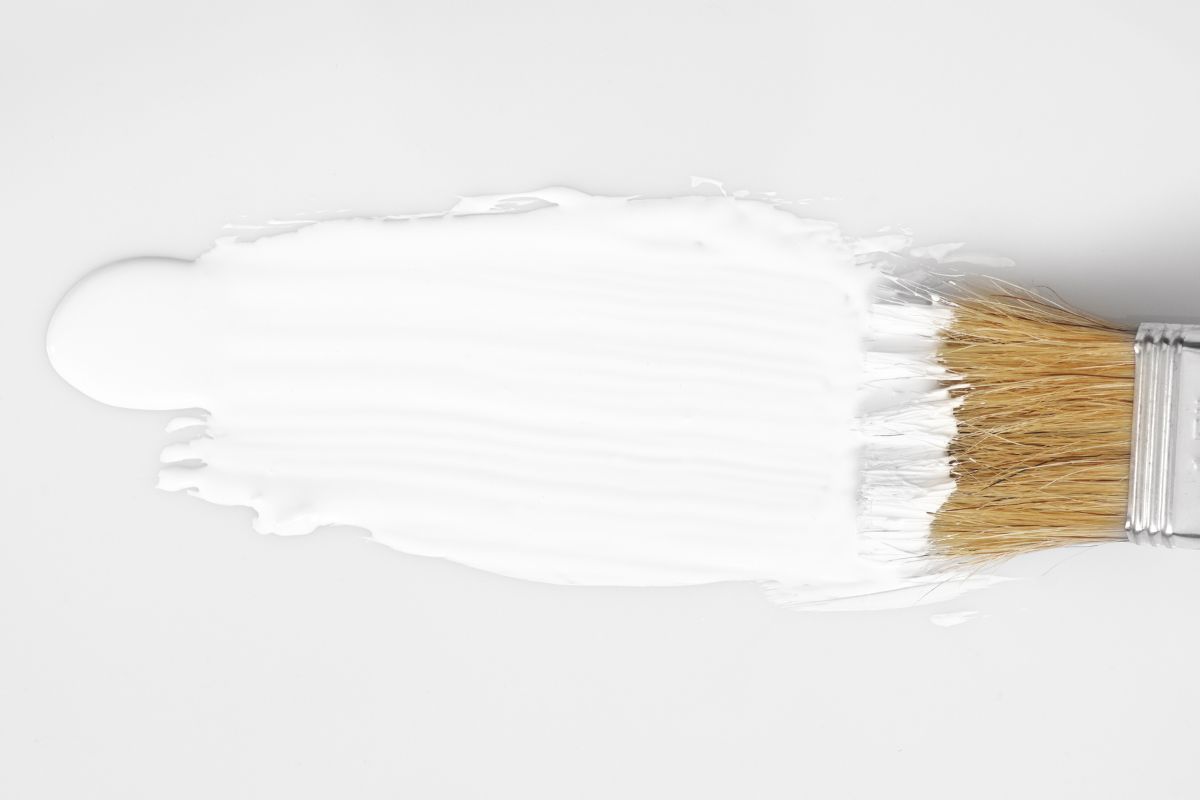 white paint and brush